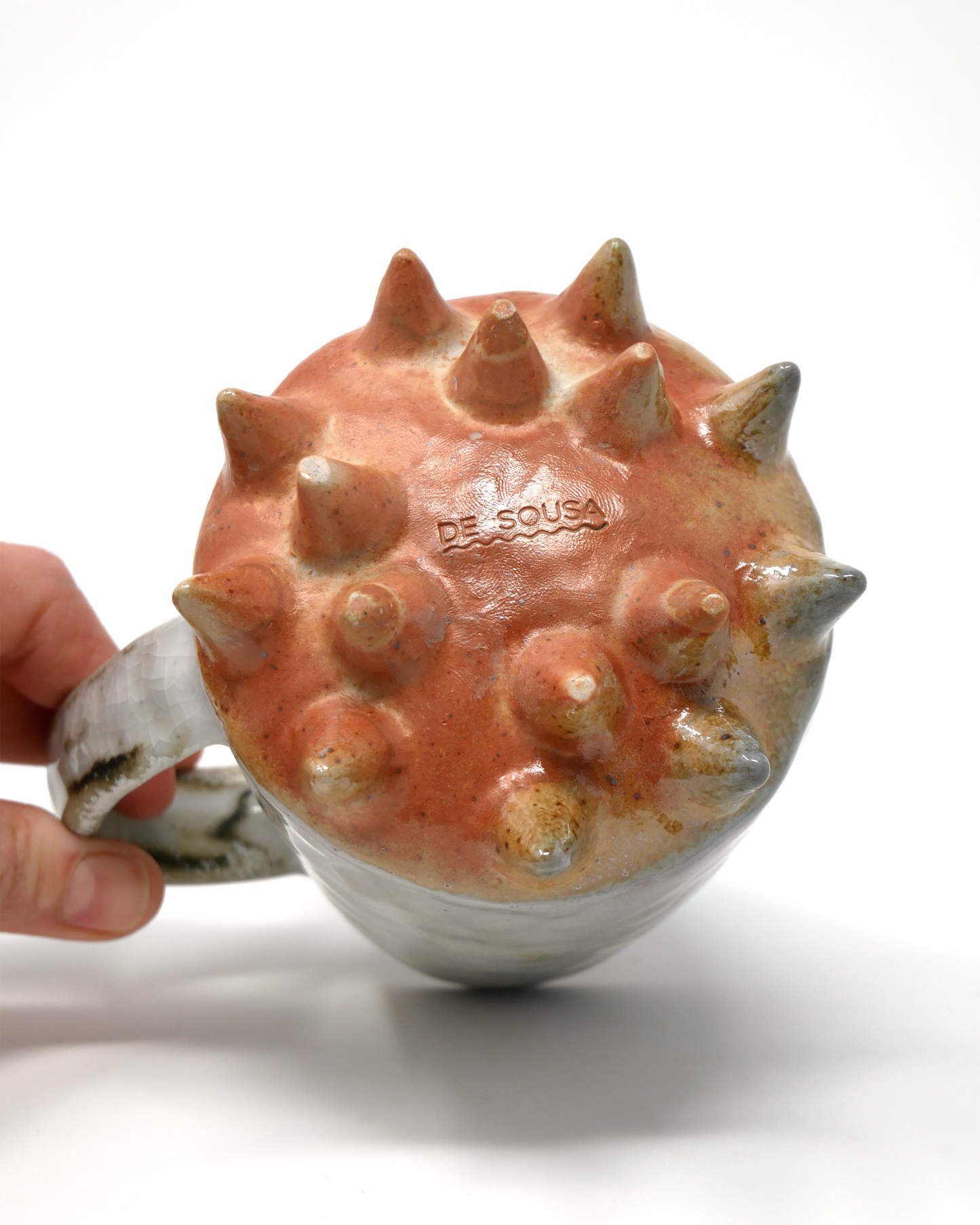 Spiked-bottom mug